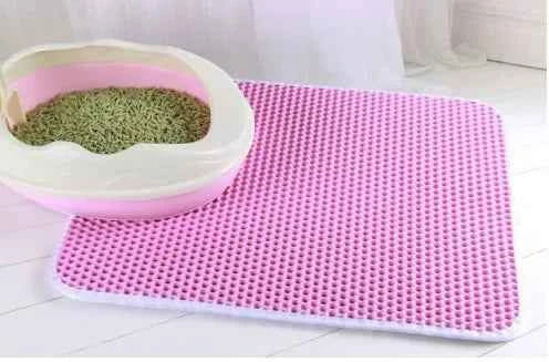 Emptying trapped litter from a double-layer cat mat